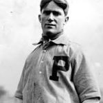 The league-leading Phils are dealt a blow when catcher-manager Red Dooin suffers a broken leg in a collision at home plate