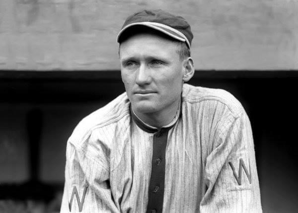 1913 – Walter Johnson’s 14-game winning streak is ended, although it takes Boston 11 innings to beat him 1 – 0. Boston manages a 2nd-inning single by Steve Yerkes and doesn’t have another baserunner until Yerkes singles again in the 11th, and reaches third as the ball goes through the legs of CF Clyde Milan. A fielder’s choice and a single win it. Johnson strikes out 10, including five in a row, and walks none.