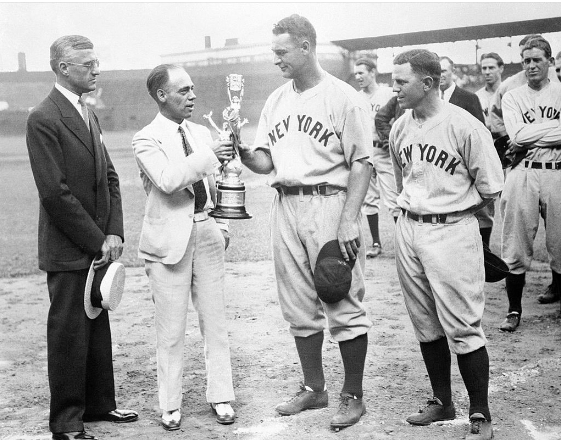 Sportsman's Park, St Louis: Lou Gehrig accepts trophy for playing in then-record 1,308th consecutive game, passing Everett Scott (now 3rd all-time) - L-R AL prez William Harridge; Sporting News editor EG Brands; Joe Sewell, who played in 1103 straight (7th all-time)