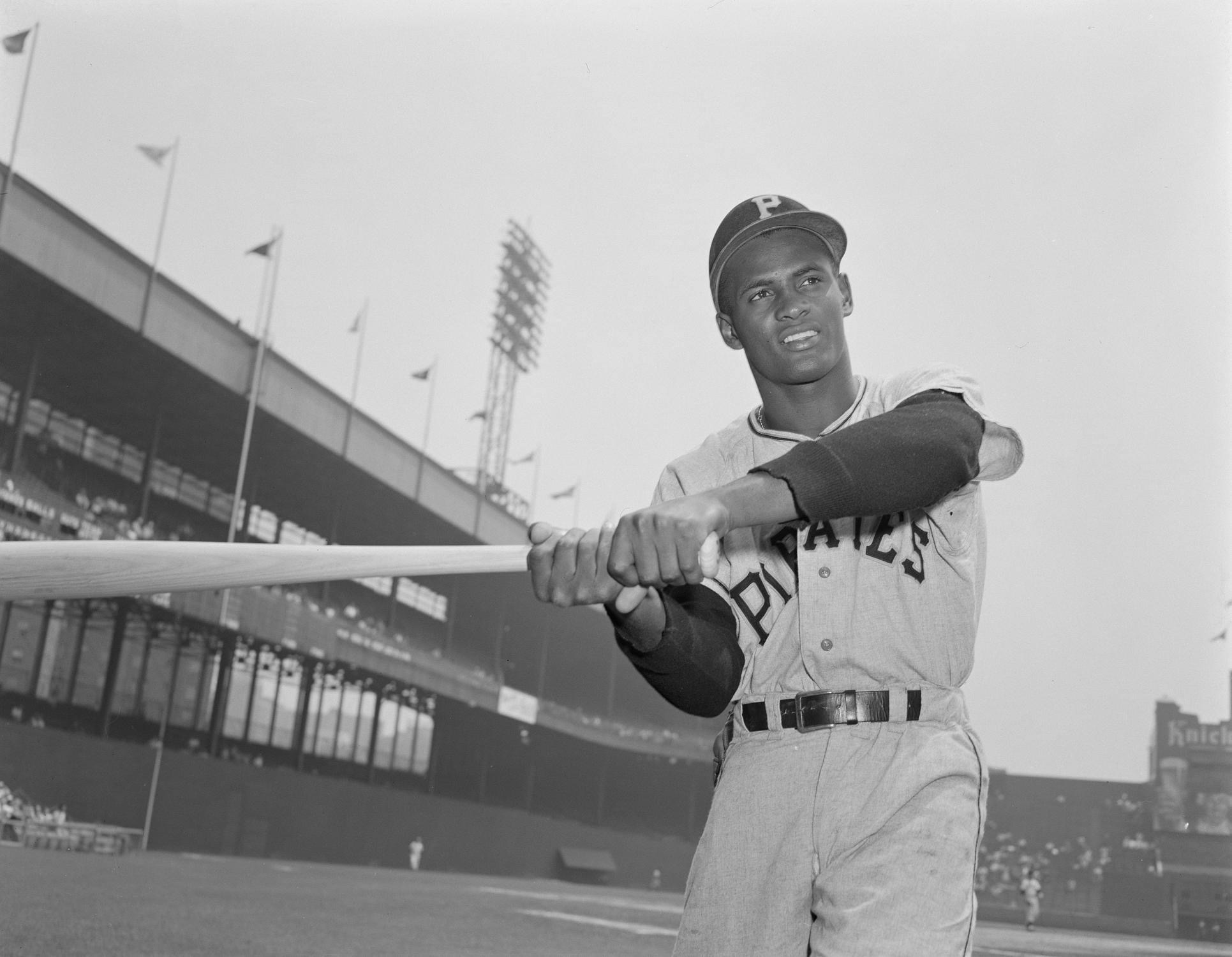 Roberto Clemente's first major league home run – a 440- to 450-foot inside-the-parker off Giants southpaw Don Liddle – arrives three games into his big league career and it's just his luck that it occurs in the one stadium that, due to its freakish configuration, could possibly have contained this blast, namely the Polo Grounds, that semi-rectangular oddity wherein 279- and 257-foot foul lines coexist with 455- and 449-foot power alleys. This first New York visit also has a deeper significance for Clemente since, in his third major league game, he's playing on the same field with both his new mentor and role model, Willie Mays (alongside whom he was playing just two months earlier in Santurce), and his boyhood hero, Monte Irvin, whose winter ball career Clemente monitored religiously in the late 1940s and who, in the interim, has himself become both a teammate and something of a mentor to Mays.