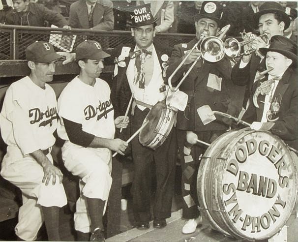 During a double-header against the Cardinals, a ragtag group of five ‘musicians’, dubbed the Dodger SymPhony by announcer Red Barber, makes their Ebbets Field’s debut. This band, in which none of the members can read music, performs their zany antics at all evening and weekend games.