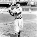 With two outs and two strikes in the last of the 9th, Dolph Camilli hits a two-run homer to give the Dodgers a 5 - 4 win over the Braves. With the homer, his 20th, Camilli takes over the National League lead.