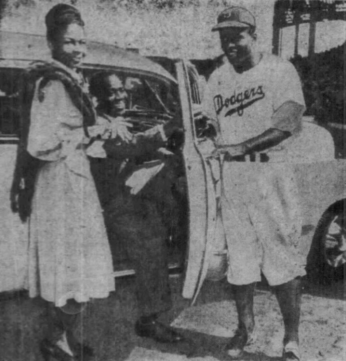 Fans present Jackie Robinson with a car