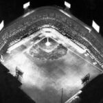 1948 - The Detroit Tigers beat the Philadelphia Athletics, 4 - 1, before a crowd of 54,480 in the first night game at Briggs Stadium. The Tigers are the last American League team to install lights.