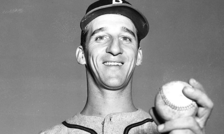 The Boston Braves increase their lead to 4 games as Warren Spahn lasts 14 innings to beat Da Bums‚ 2 – 1. Spahn twice picks off Jackie Robinson in his 5-hitter. In the 7-inning nitecap‚ Johnny Sain wins‚ 4 – 0. Bill Salkeldand Mike McCormick bat out of turn 3 times in game 2 and not till the latter’s single in the 5th is the irregularity noticed. The umps then rule he’s out of turn and he loses his hit; Salkeld’s two earlier hits stand. The crowd of 40‚000 pushes the Braves attendance over the 1.3 million mark‚ a new high. Spahn and Sain will start 11 of the next 16 games.