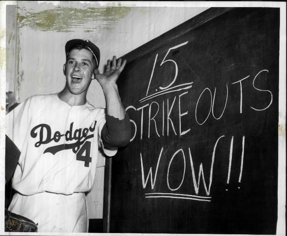 Karl Spooner, in his major league debut, blanks the Giants at Ebbets Field, 3-0. The 23 year-old Dodger southpaw fans 15 batters, including six straight, recording the most strikeouts in a first appearance by a rookie.