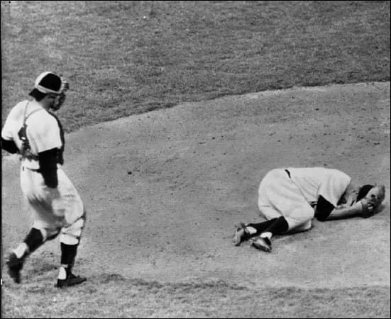 Cleveland Indians pitcher Herb Score is struck in the right eye by a line drive hit by the New York Yankees’ Gil McDougald