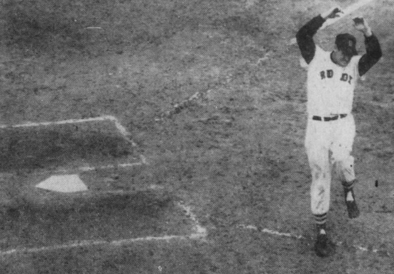 Ted Williams, after striking out looking with two aboard to end the 3rd inning flings his bat aside in a fit of anger