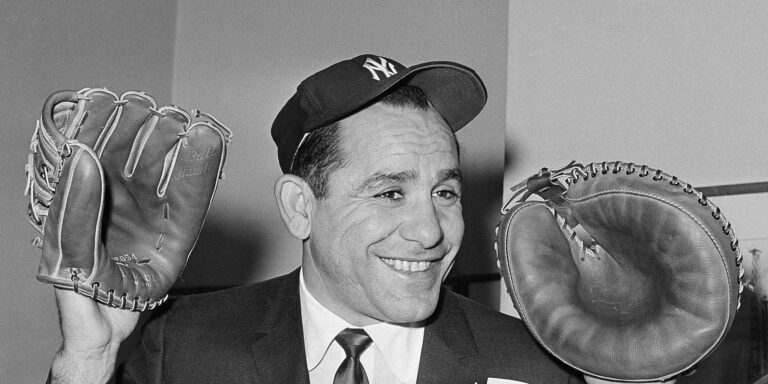 Representing Major League Baseball, the Yankees’ Yogi Berra visits Italy to present baseball equipment and aid in the sport’s development.