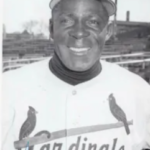 Minnie Minoso suffers a fractured skull and breaks his wrist when he runs into the left field wall chasing Duke Snider's triple in the Cardinals' 8-5 loss to L.A