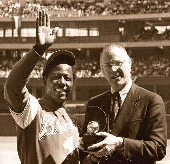 Commissioner Bowie Kuhn orders the Atlanta Braves to play Hank Aaron