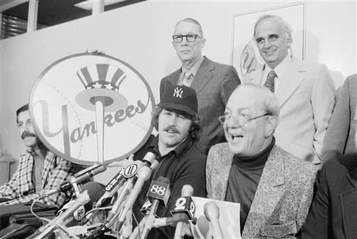 Catfish hunter signs with yankees