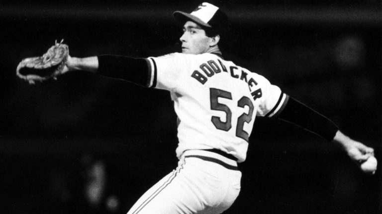 In the second game of the ALCS, Oriole hurler Mike Boddicker throws a five-hitter, beating the White Sox at Memorial Stadium, 4-0. The Baltimore right-hander, whose performance evens the series, establishes a playoff record when he strikes out 14 Chicago batters.