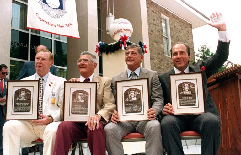 Johnny Bench, Carl Yastrzemski, Red Schoendienst and umpire Al Barlick are inducted into the Hall of Fame at ceremonies in Cooperstown, New York.