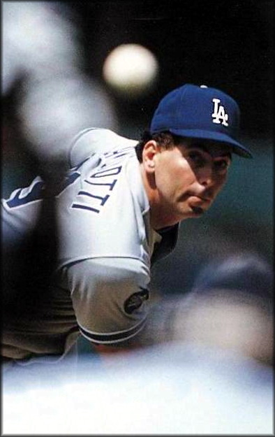 The Los Angeles Dodgers sign free agent knuckleballer Tom Candiotti to a four-year contract.