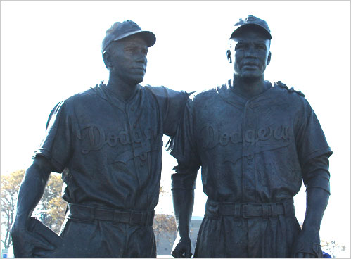 A bronze sculpture capturing the friendship of Pee Wee Reese and Jackie Robinson is unveiled at Brooklyn’s KeySpan Park