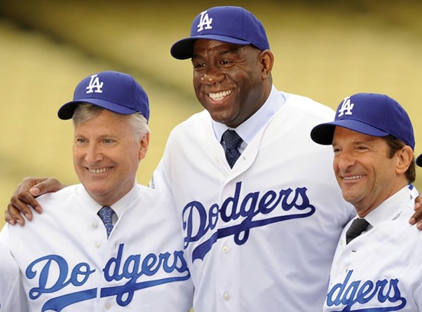 The group led by former NBA star Magic Johnson and executive Stan Kasten emerges as the winner of the bidding process to buy the Los Angeles Dodgers from owner Frank McCourt