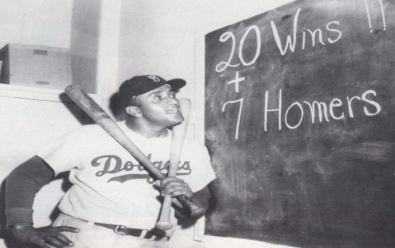 rooklyn Dodgers pitcher Don Newcombe hits two home runs in a 10-8 victory