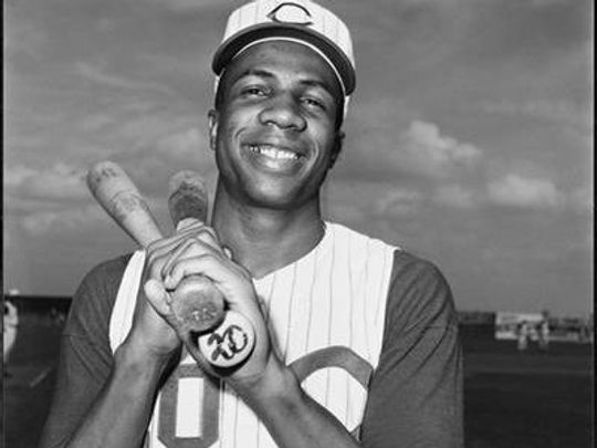 Frank Robinson of the Cincinnati Reds hits three home runs in an 11-4 win over the St. Louis Cardinals