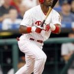 Jimmy Rollins hits a double on opening day to extend his hitting streak to 37