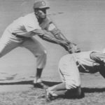 1962 Reds Don Zimmer gets caught in a rundown, and is tagged out by Chicago Cubs SS Andre Rodgers as he dives back to second.