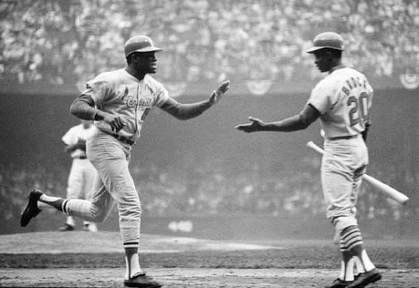 Lou Brock and Bob Gibson after a Gibson Homerun