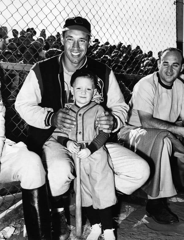 A child poses with Cleveland Indians pitcher Bob Feller at Burbank’s Olive Memorial Stadium in 1949.