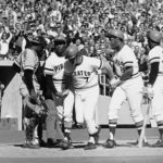 Bob Robertson (7) is congratulated by teammates Roberto Clemente, second from left, Willie Stargell