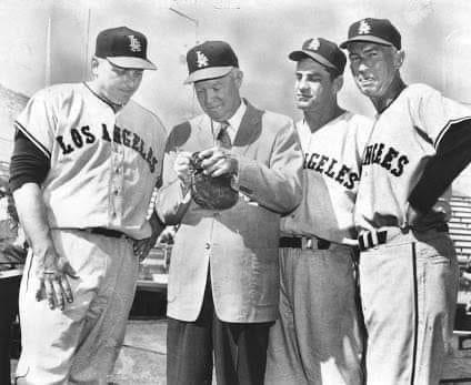 former President Dwight Eisenhower jokes with the Angel players