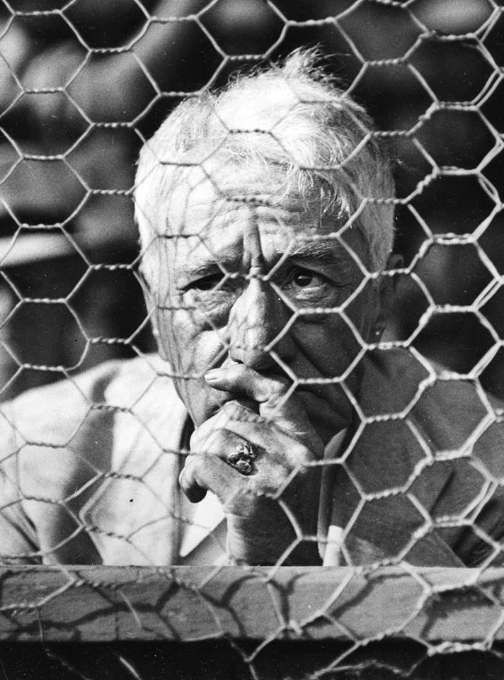 Judge Kennesaw Mountain Landis, commissioner of baseball, watches a spring-training game in St. Petersburg, Fla