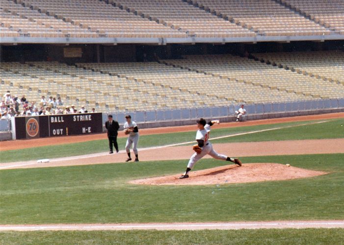 19 year old Jim Palmer on the mound at Dodger Stadium on June 6, 1965. The home team was the California Angels who would move south to Anaheim in 1966. Brooks Robinson is ready vacuum up anything that comes his way at 3rd base.