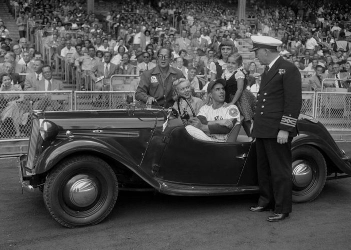Capt. Leslie Banyard presents a sports car to New York Yankees shortstop Phil Rizzuto