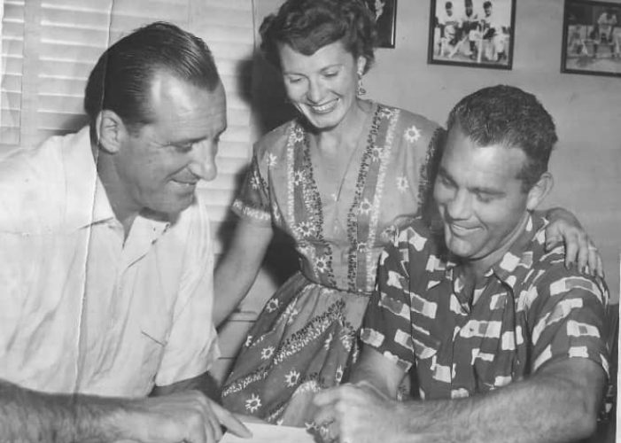 Ferris Fain signs a contract with the Indians as his wife and Cleveland GM Hank Greenberg look on
