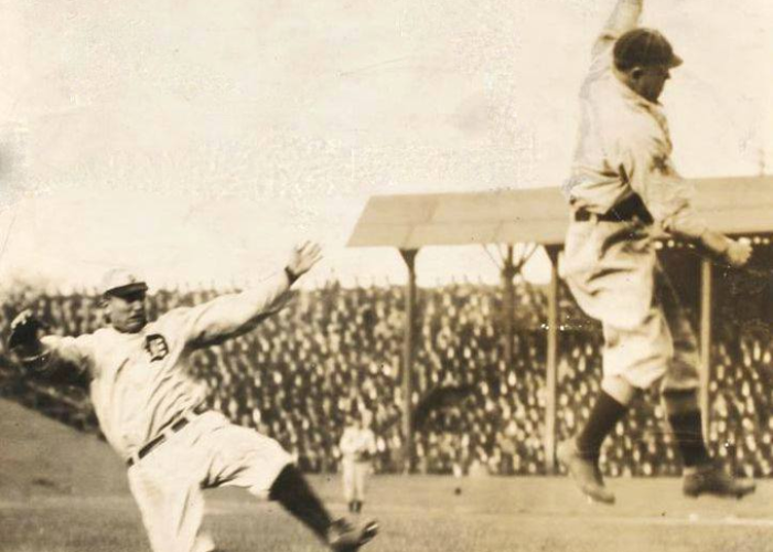 Ty Cobb steals third base against St Louis Browns at Sportsman Park, October 2, 1908.