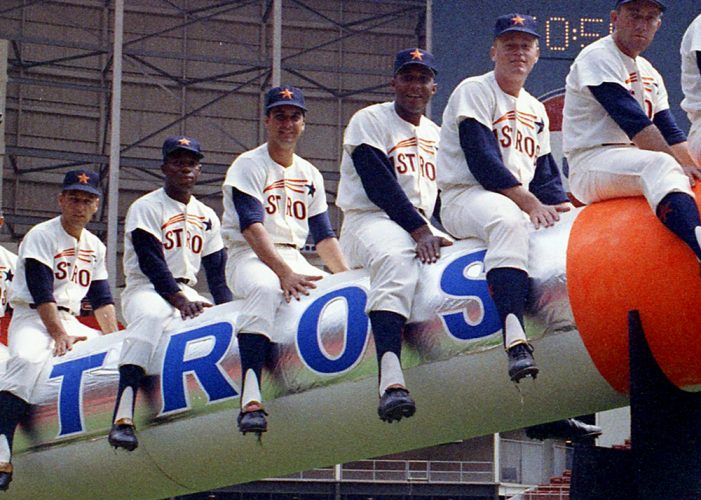 From the April 12, 1965, Houston Post: It is purely symbolic, of course, but Manager Luman Harris hopes to send his Houston Astros into space this season -- or at least to an altitude beyond last year's ninth place finish in the National League. The Astros open the 1965 season Monday night at the Domed Stadium against the Philadelphia Phillies, and carrying the payload will be these nine starters: From left, Bob Bruce, pitcher; John Bateman, catcher; Bob Lillis, shortstop; Jimmy Wynn, centerfield; Bob Aspromonte, third base; Walt Bond, first base; Rusty Staub, right field; Al Spangler, left field, and Joe Morgan, second base. Manager Harris puts the torch to the Astrorocket, bound -- he hopes -- for a higher finish.