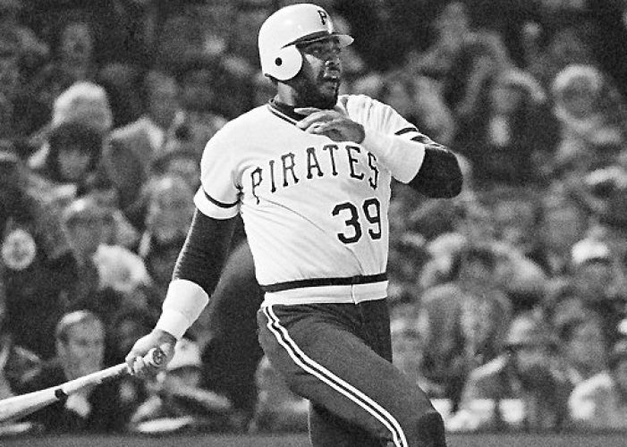 Pirates Dave Parker smashes ball that took a bad hop in front of Orioles Rich Dauer